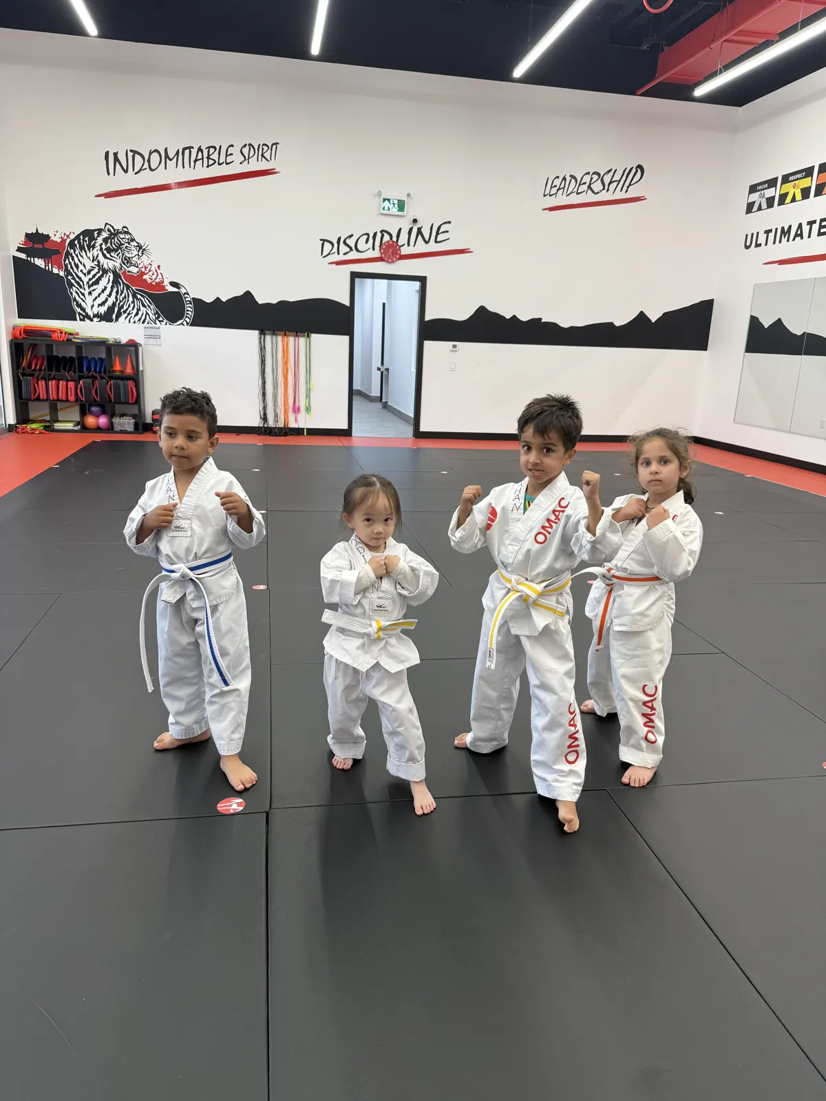 Four junior students in fighting stance